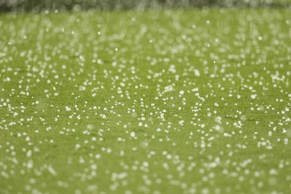 Hail on the field as the storm hits.
