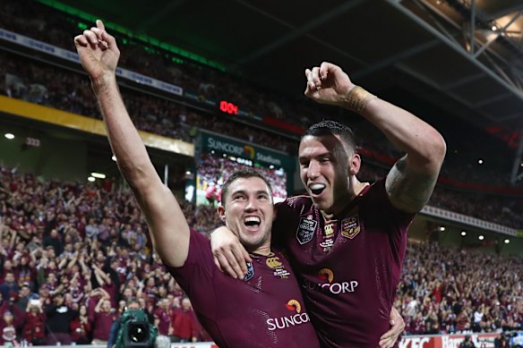 Corey Oates of the Maroons celebrates with his team mate Darius Boyd