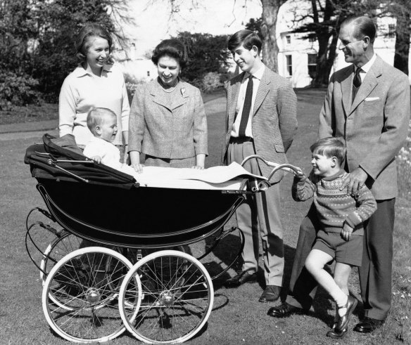 (L-R) Princess Anne, Queen Elizabeth II, Prince Charles, Prince Philip, Prince Andrew and baby Prince Edward on the grounds of Windsor Castle.  