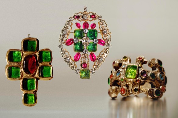 Pieces in the exhibition include, centre, a pendant of diamonds, emeralds and synthetic stones worn by Gabrielle Chanel between 1950 and 1960, and a crucifix pendant and bangle from 1965-66 made by Robert Goossens.