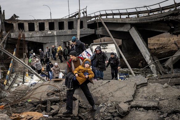 Residents of Irpin flee heavy fighting via a destroyed bridge as Russian forces entered the city. Russia continues its assault on Ukraine's major cities, including the capital Kyiv, more than a week after launching a large-scale invasion of the country.