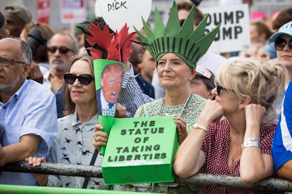 'The Statue Of Taking Liberties'. A demonstrator dressed as the Statue of Liberty joins a protest against U.S. President Donald Trump in central London, U.K., on Friday, July 13, 2018. 