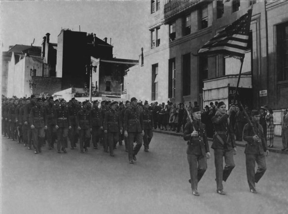 “A large crowd in Martin Place on Saturday morning saw a ceremonial parade of U.S. soldiers and nurses and Filipino soldiers...”