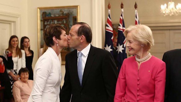 Tony Abbott kisses his wife Margie after he was sworn  in as Australia's 28th Prime Minister by Governor-General Quentin Bryce at Government House in Canberra.