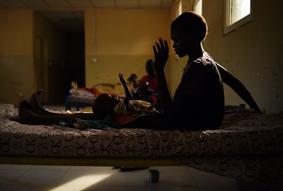 Nyereka Maliyah, 20, with her baby Dictor Geng, 1, who is ill and being treated at the CARE Stabalization point at Bentiu hospital, Bentiu, Unity State, South Sudan. 