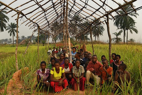 Students sit where their desks once were, amongst the ruins of their Kabukole School after it was burnt down during the fighting in the Kasai conflict. At least 639 schools were burnt down in the conflict and World Vision is assisting in providing materials to build again as in the case with the Kabukole School. 