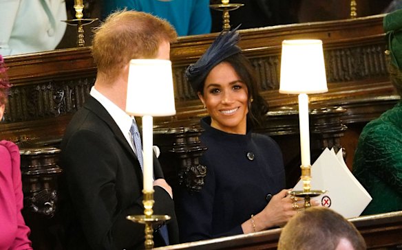 Prince Harry and Meghan, Duchess of Sussex take their seats ahead of the wedding of Princess Eugenie of York and Jack Brooksbank.