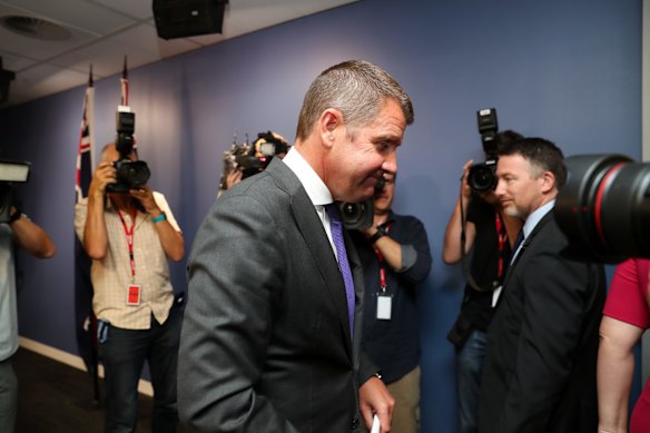 Premier Mike Baird leaves a press conference after announcing his resignation in Sydney. 