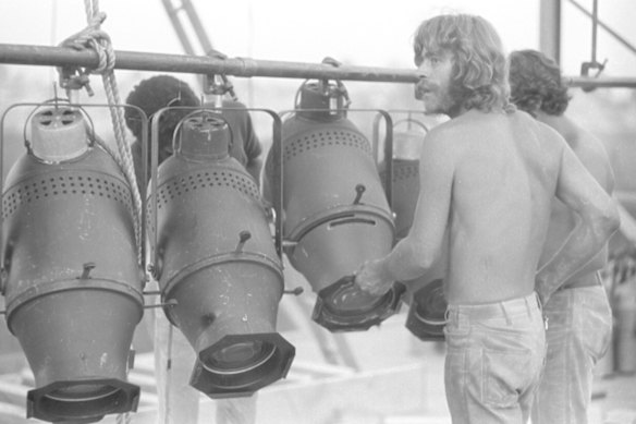 Chip Monck assembles the lighting rigs.