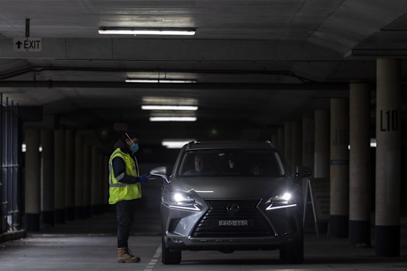 COVID-19 testing is carried out at the underground carpark at Marconi Stadium, Restwell Road, Bossley Park, as tighter lockdown restrictions are announced for Greater Sydney.