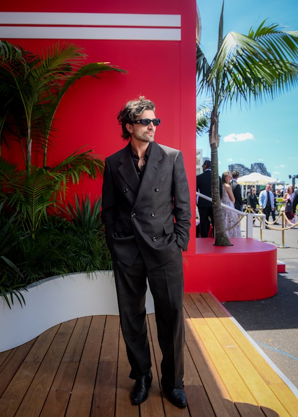 Joshua Kempen takes off his tie but keeps it tonal in Emporio Armani.