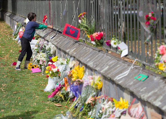 A floral tribute on the fence of the Christchurch Botanic Gardens.