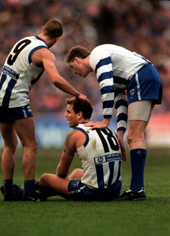 Wayne Carey with teammates Brett Chandler (left) and Mark Roberts in 1998.