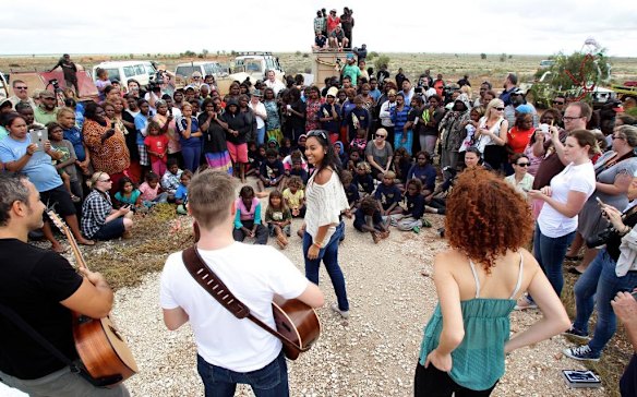 Jessica Mauboy hugs a young Aboriginal girl who was brought to tears when she joined Jessica Mauboy during her performance at Watson on The Nullabor Plain in South Australia for children from Oak Valley Aboriginal School. The concert in Watson is the highlight of many performances across Australia on the Indian Pacific Outback Christmas Train. 