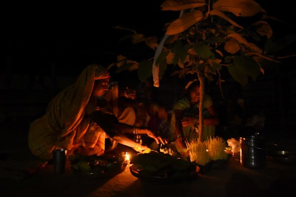 The villagers around the PEKB open cut coal mine are mostly Gonds, an indigenous group that worship trees, which they pray to in elaborate ceremonies, such as this one, in Hariharpur. They say their way of life is threatened by the mine, which is just 500 metres from the village.