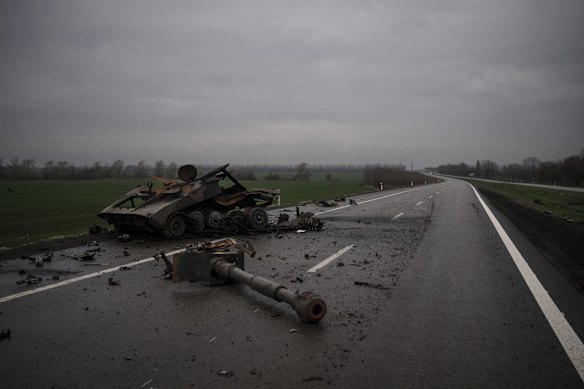 The remains of a destroyed Russian artillery unit lies in the road near Kharkiv.
