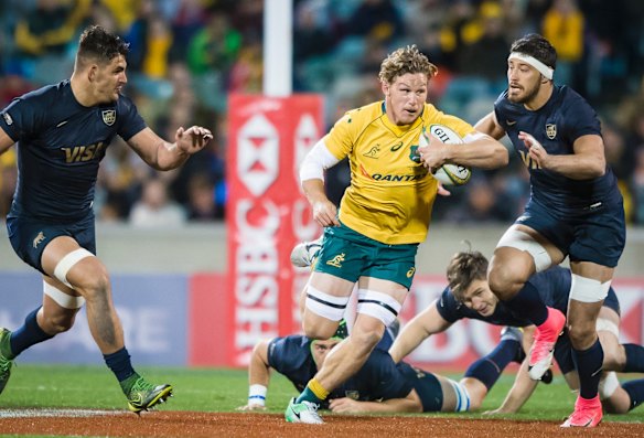 Wallabies skipper Michael Hooper makes a line break.
