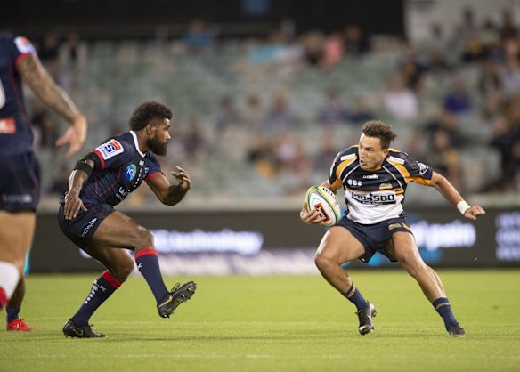 Brumbies fullback Tom Banks tries to evade Rebels' Marika Koroibete. 