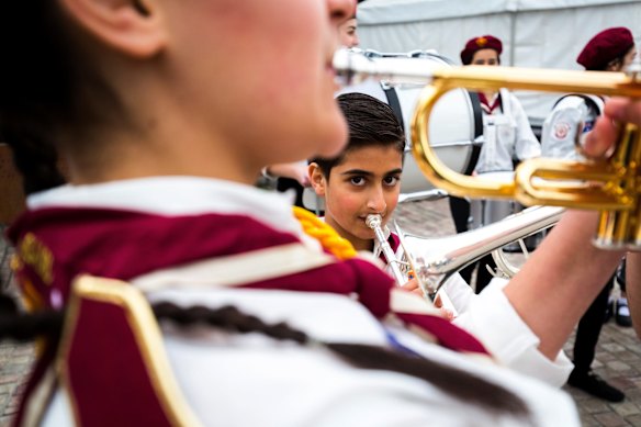 Aboud is seen playing with the Syrian Youth Marching Band, all recently arrived refugees, during its first ever performance at the Winter Solstice Festival of Welcome at Federation Square, Melbourne.