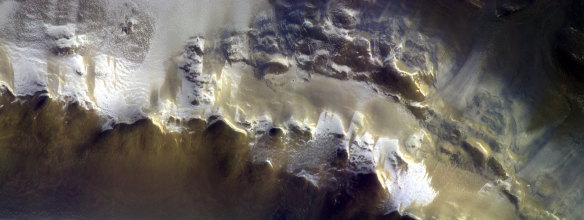  The European Space Agency has released its first image taken by a probe orbiting Mars, showing the ice-covered edge of the vast Korolev Crater. 