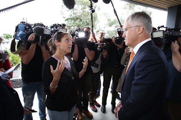 Single mother of two Melinda (second name withheld) confronts Prime Minister Malcolm Turnbull on family tax benefits and education funding outside Marand engineering in Moorabbin, Melbourne on Thursday 12 May 2016.