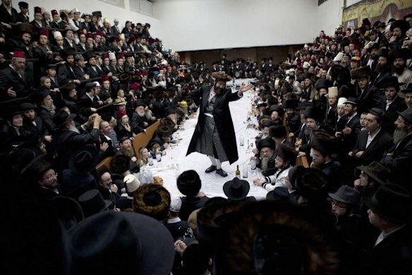 An ultra-Orthodox Jewish man dances while celebrating the Purim.