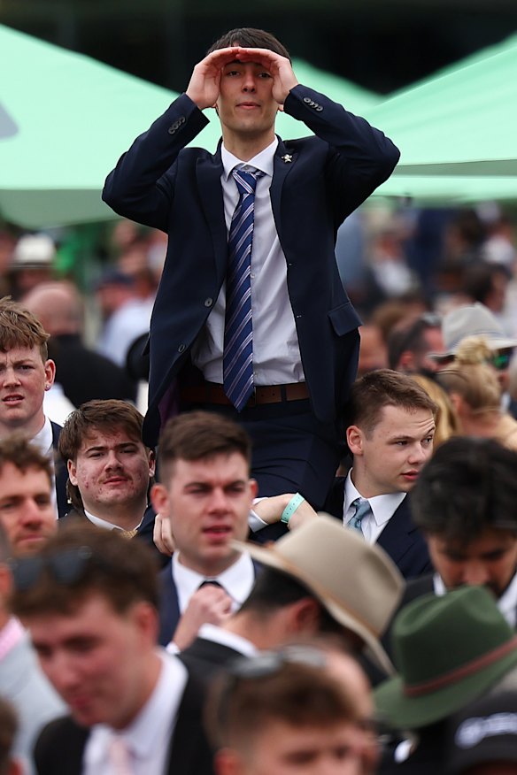A sea of young men waiting to find their fashion footing at Flemington Racecourse on Cup Day.