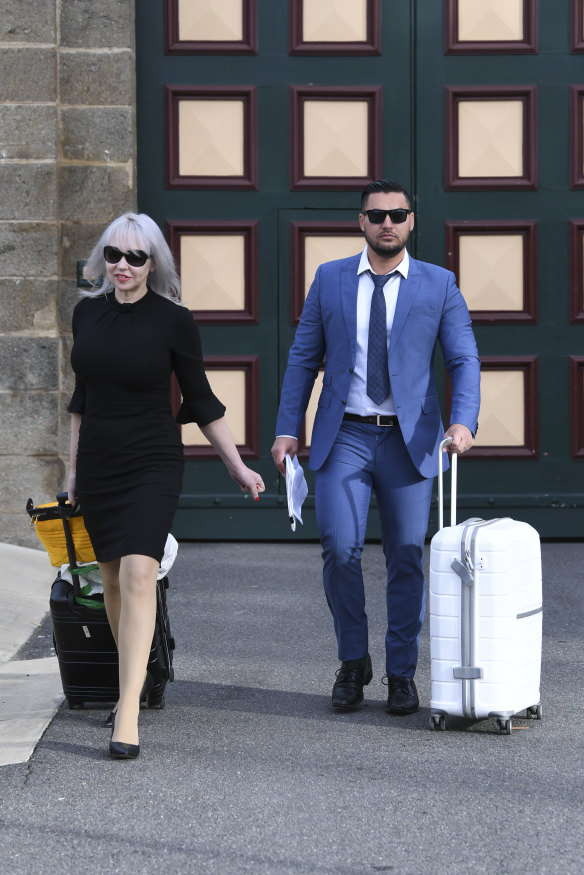 Zali Burrows and Salim Mehajer make their way to the waiting 60 Minutes crew outside Cooma prison on Tuesday.