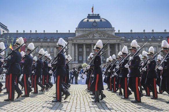 Belgium's Crown Princess Elisabeth marches with cadets of the military school as they march by the Royal tribune during the National Day parade in Brussels.