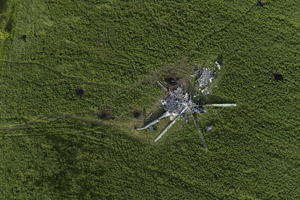 The remains of a destroyed Russian helicopter lie in a field in the village of Malaya Rohan, Kharkiv.