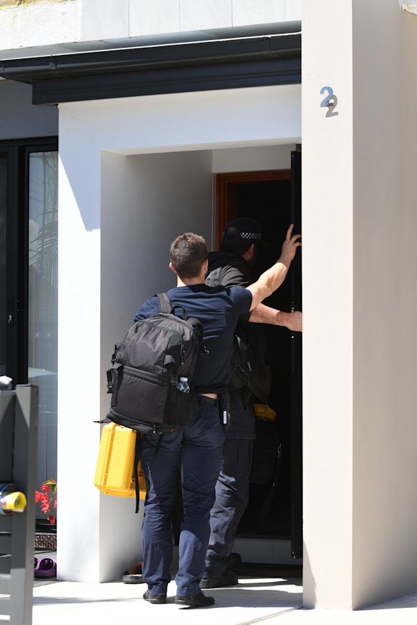 NSW Police forensic officers at the house. 