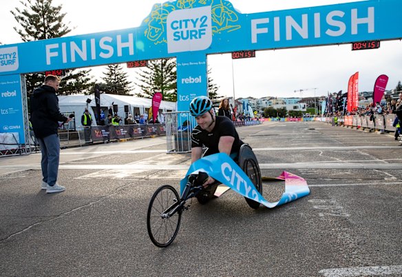 Wheelchair division winner Sam Rizzo crosses the line.
