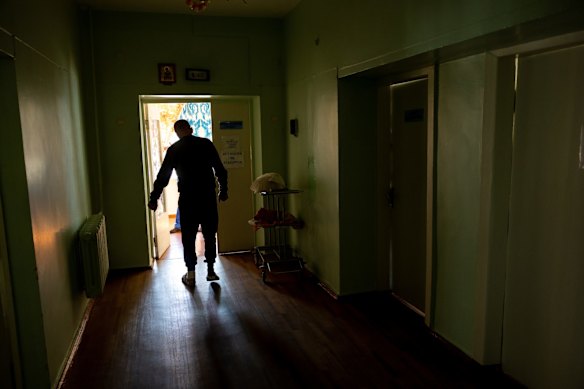 Oleksandr, 51, limps to a treatment room to have his bandages changed. He was wounded during Russian shelling in the village of Vysokopillya in the Kherson region of southern Ukraine.