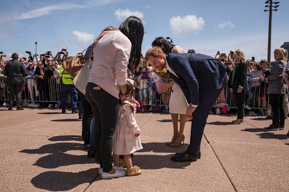 The Duke and Duchess Harry and Meghan meet the crowd outside the Opera House in Sydney.