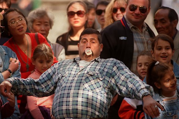 Fawez Saleh from Middle Park leans back and prepares to fire in the Spit the Dummy Competition run by the Kiwanis club from Nunawading, part of Moomba festivities on Swanston Walk, 1997.