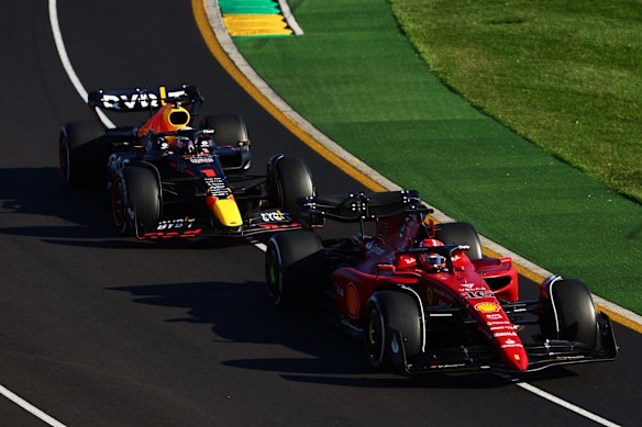 Charles Leclerc of Monaco driving (16) the Ferrari F1-75 leads Max Verstappen of the Netherlands driving the (1) Oracle Red Bull Racing RB18.