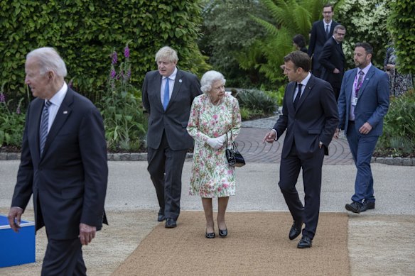 French President Emmanuel Macron, Queen Elizabeth II, British Prime Minister Boris Johnson and United States President Joe Biden arrive at a drinks reception for Queen Elizabeth II and G7 leaders at The Eden Project during the G7 Summit on June 11, 2021 in St Austell, Cornwall, England.