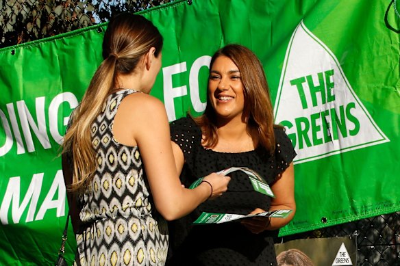Greens candidate in the Northcote by election, Lidia Thorpe hands out how to vote cards at Thornbury primary school on 18th November, 2017.