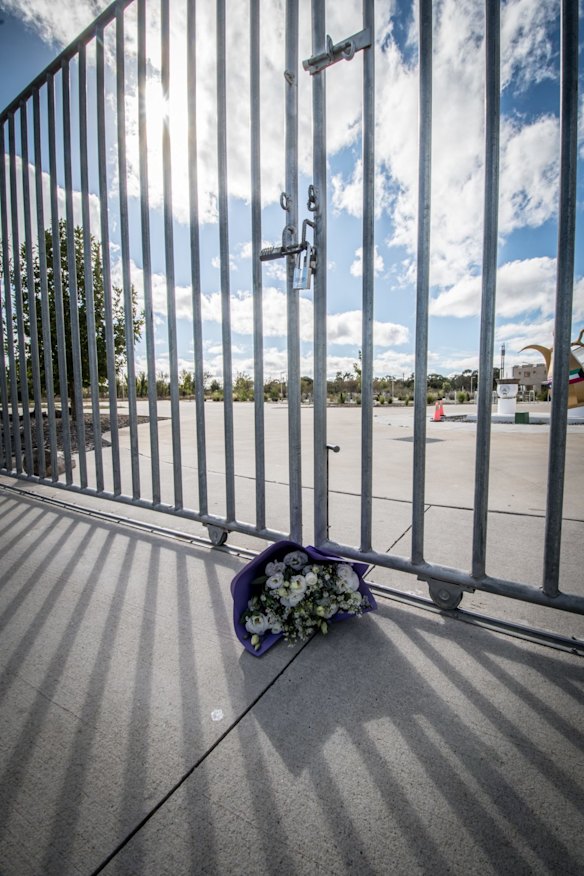 A solitary bunch of flowers at the gate of the Canberra Islamic Centre in Monash on Saturday morning.