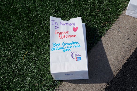 Track side tributes at Tartan High for cancer victims and survivors.