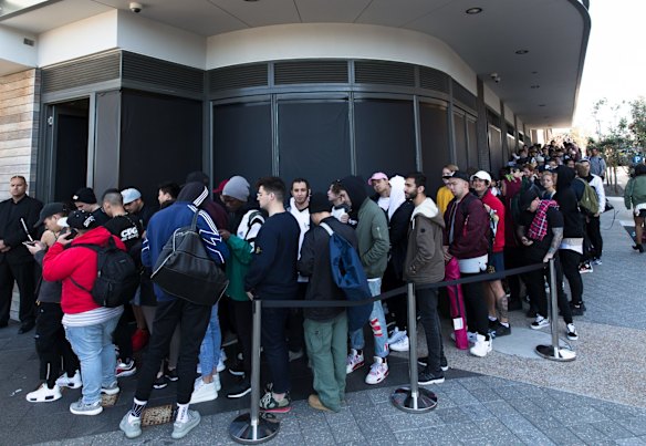 Kanye West fans line up for the opening of his pop up clothing store in Bondi, Sydney. The queues started forming at 6 pm the night before the 10am opening, with many people paying others to sleep in line for them.