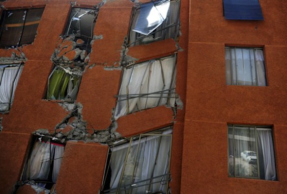A Santiago apartment block shows major damage.