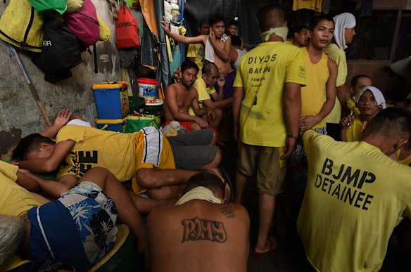 Inmates sleeping in shifts in what was a classroom inside Quezon City Jail, Manila, Philippines.