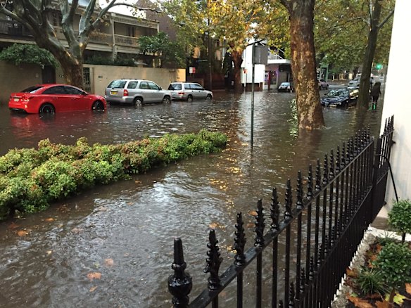 Crown Street, Surry Hills completely flooded after heavy rain overnight.