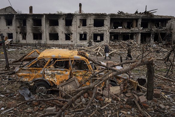 Civilians walk through the shattered streets of Chernihiv, which came under heavy Russian shelling.