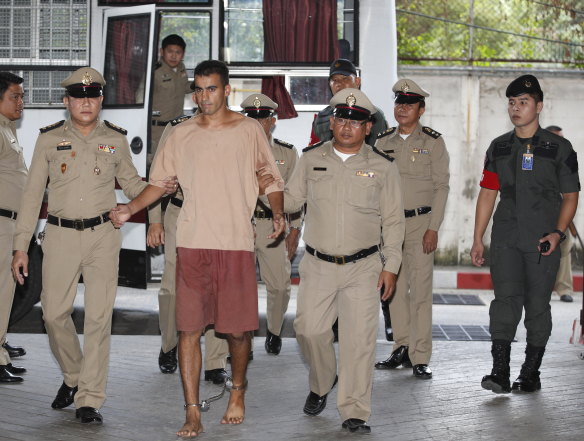 Hakeem Al-Araibi arrives at the Bangkok court on Monday with his legs shackled.