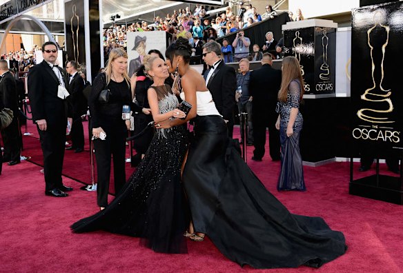 HOLLYWOOD, CA - FEBRUARY 24:  Actress-singer Kristin Chenoweth (L) and singer Kelly Rowland attend the Oscars at Hollywood & Highland Center in Hollywood, California.