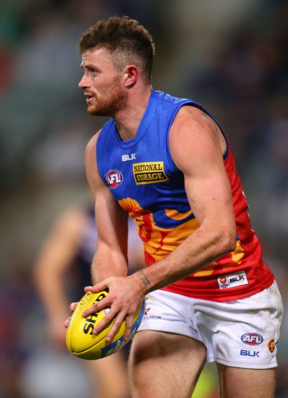 PERTH, AUSTRALIA - JUNE 21: Pearce Hanley of the Lions looks to pass the ball during the round 14 AFL match between the Fremantle Dockers and the Brisbane Lions at Patersons Stadium on June 21, 2014 in Perth, Australia.  (Photo by Paul Kane/Getty Images)
