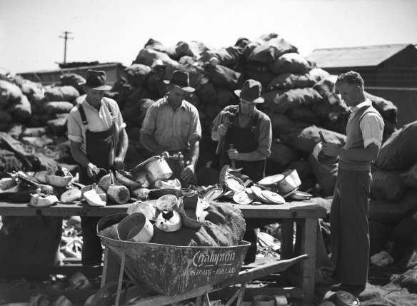 Scrap aluminium is sorted for smelting at the Department of Munitions, Granville, on March 31, 1942.