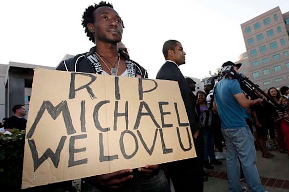 Orock Orock holds a sign outside the UCLA Medical Center, where entertainer Michael Jackson was taken, in Los Angeles.